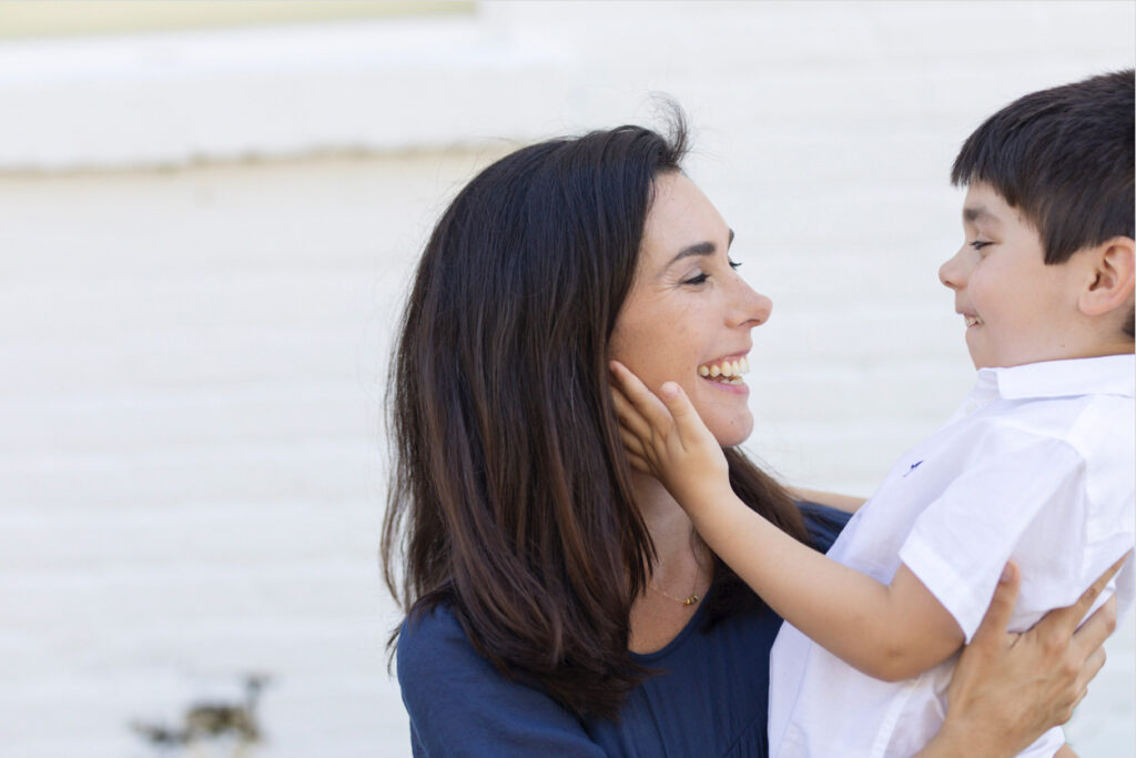 child holding mom's face